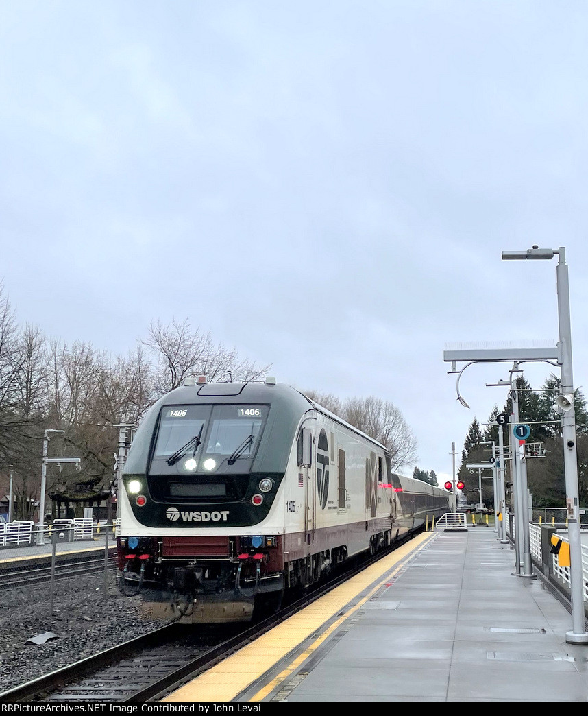 Northbound Amtrak Cascades Train # 500, with Charger # 1406 in the lead, zips past Kent Station with a Talgo Set.